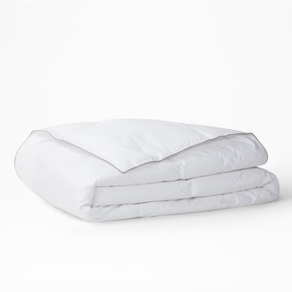 The Tuft and Needle Alternative Duvet Insert folded on a white background||weight:light