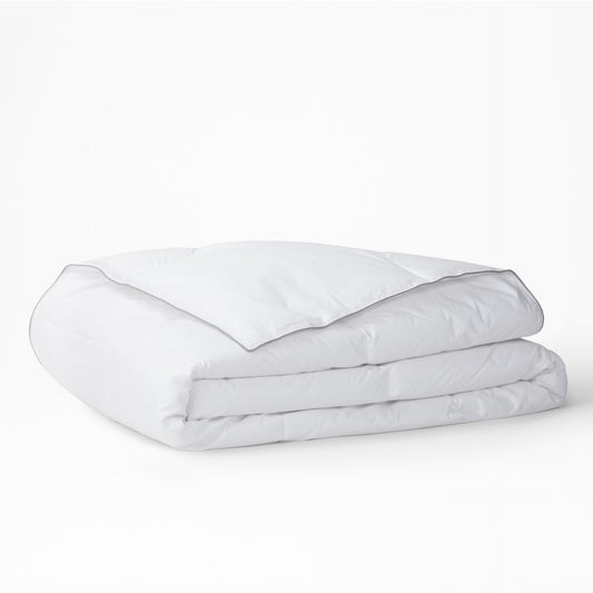 The Tuft and Needle Alternative Duvet Insert folded on a white background||weight:light