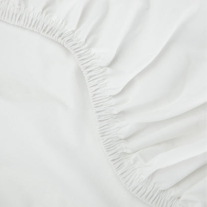 Close up of a tuft and needle mattress protector