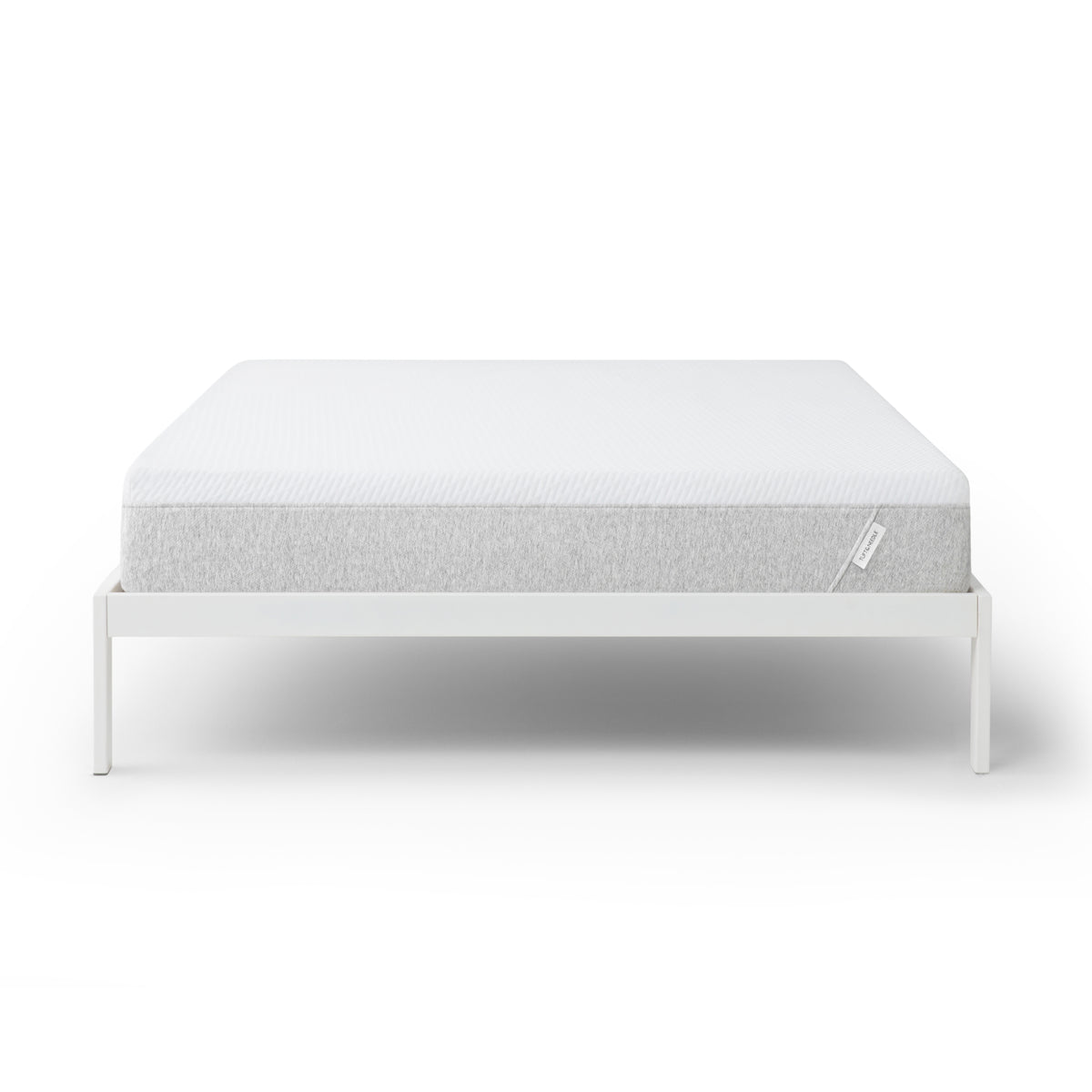 Tuft and Needle Original mattress on a white bed frame against a white background