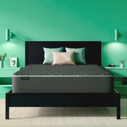 The Tuft and Needle Mint Luxe Hybrid medium Mattress in a green bedroom