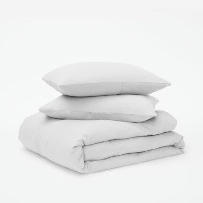 The Tuft and Needle Linen-Cotton Blend Duvet Set, 2 pillows stacked on 1 duvet covered blanket || color: Cloud

