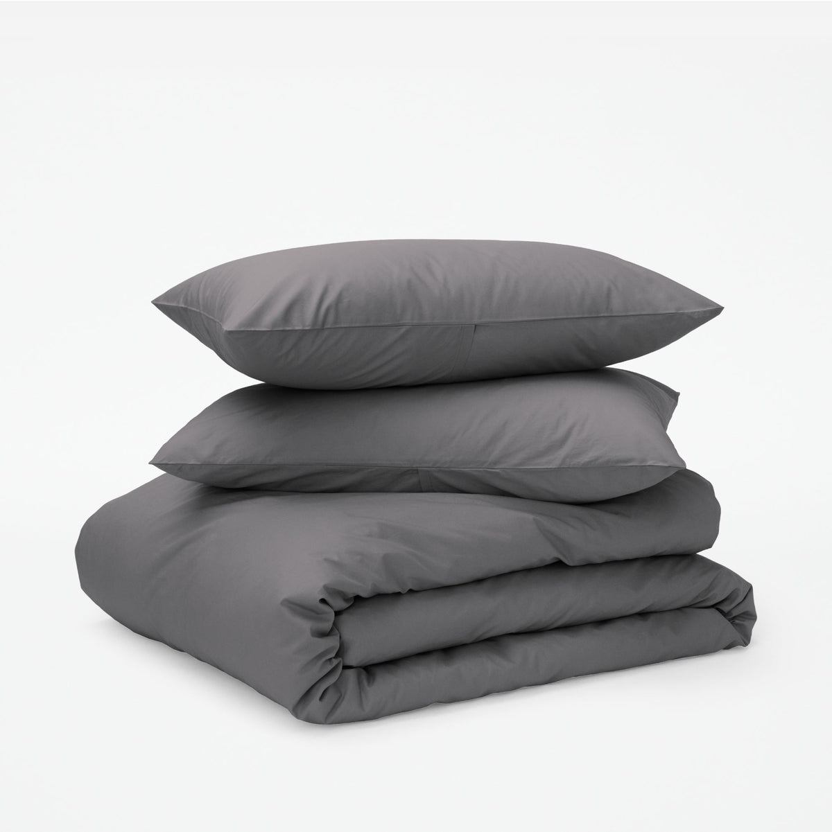 The Tuft and Needle Classic Percale Duvet Set, two pillows stacked on top of a sheet set || color: Gray Quill