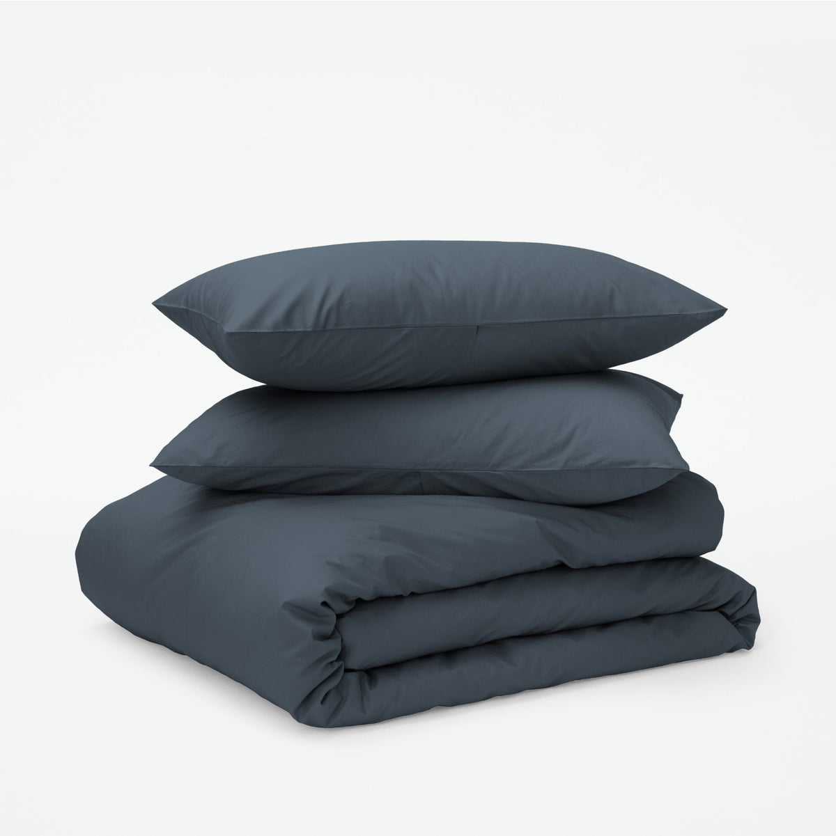The Tuft and Needle Classic Percale Duvet Set, two pillows stacked on top of a sheet set || color: Slate
