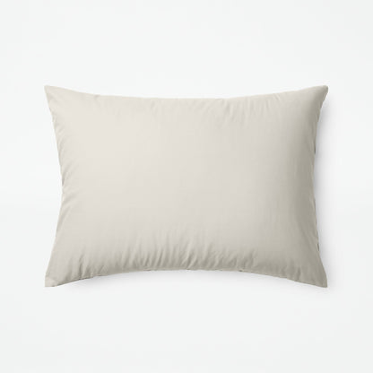 The Tuft and Needle Classic Percale Sheet Set, one pillow laying horizontally || color: Sand
