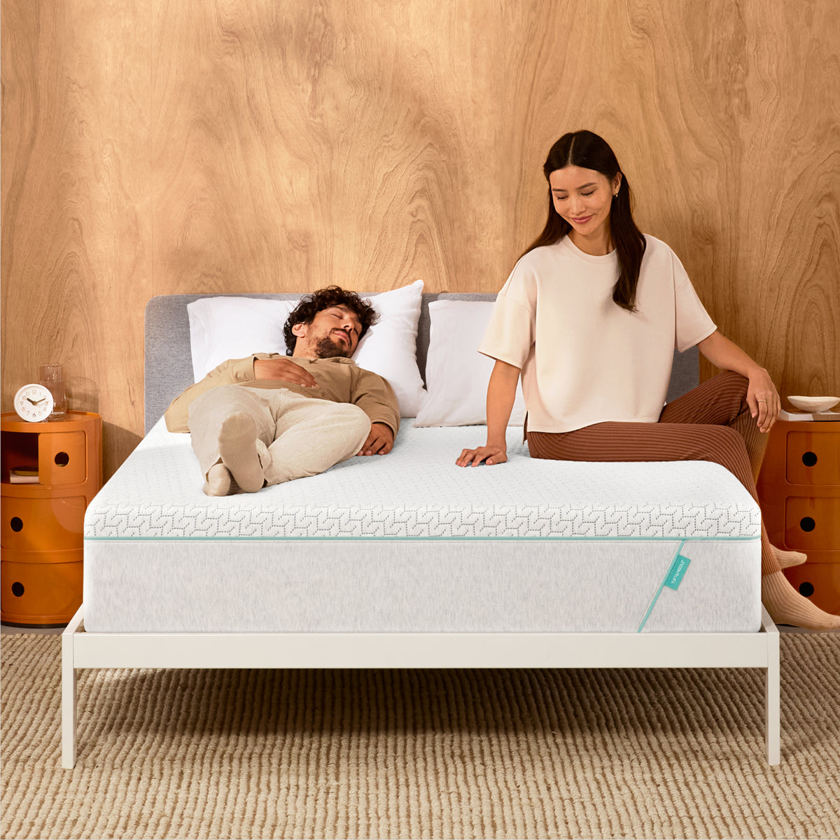 Couple lounges on mint hybrid mattress 