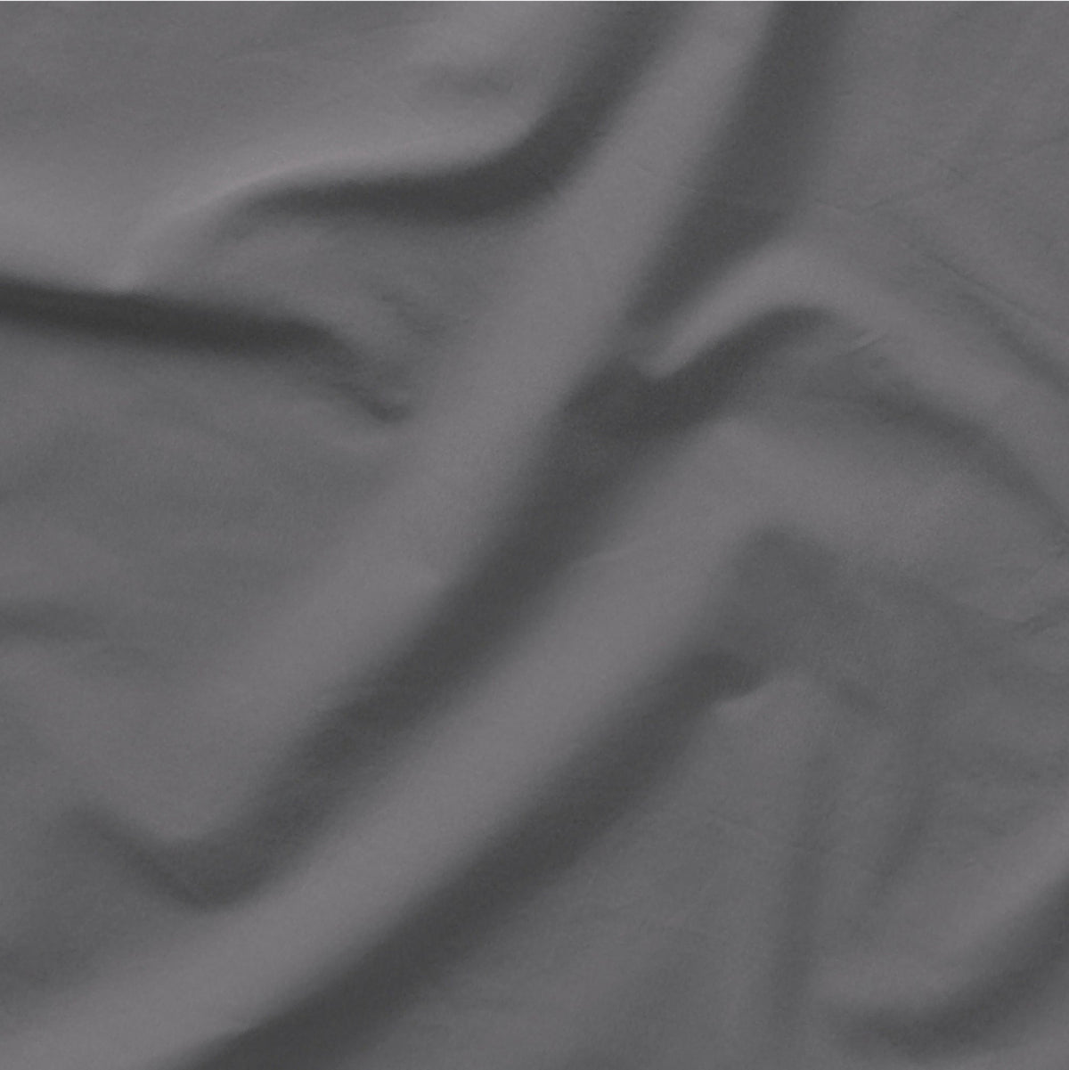 The Tuft and Needle Classic Percale Sheet Set, one sheet spread out || color: Gray Quill
