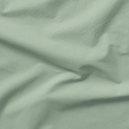 The Tuft and Needle Classic Percale Sheet Set, one sheet spread out || color: Sage