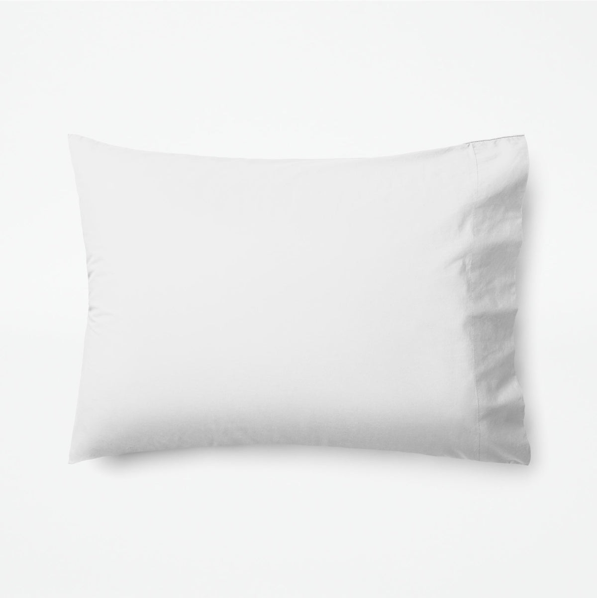 The Tuft and Needle Classic Percale Pillowcase Set, 1 pillow in a pillowcase showing in a horizontal position || color: Cloud
