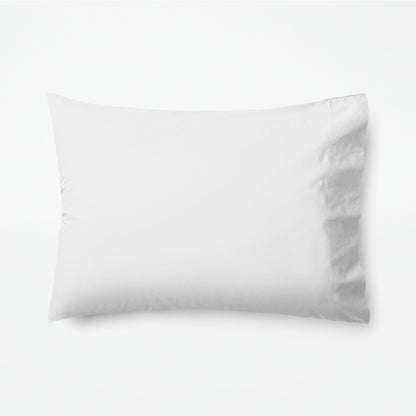 The Tuft and Needle Classic Percale Pillowcase Set, 1 pillow in a pillowcase showing in a horizontal position || color: Cloud

