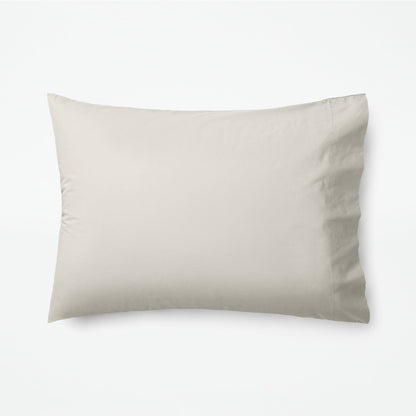 The Tuft and Needle Classic Percale Pillowcase Set, 1 pillow in a pillowcase showing in a horizontal position || color: Sand
