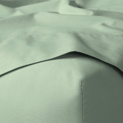 The Tuft and Needle Classic Percale Sheet Set, corner of a mattress with both sheets showing || color: Sage
