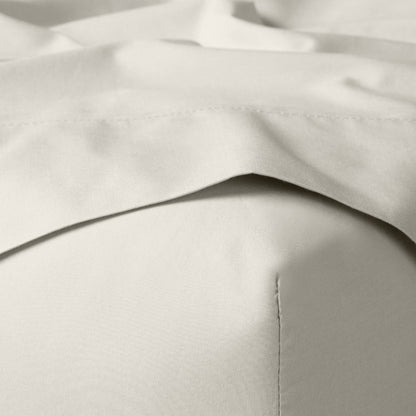 The Tuft and Needle Classic Percale Sheet Set, corner of a mattress with both sheets showing || color: Sand
