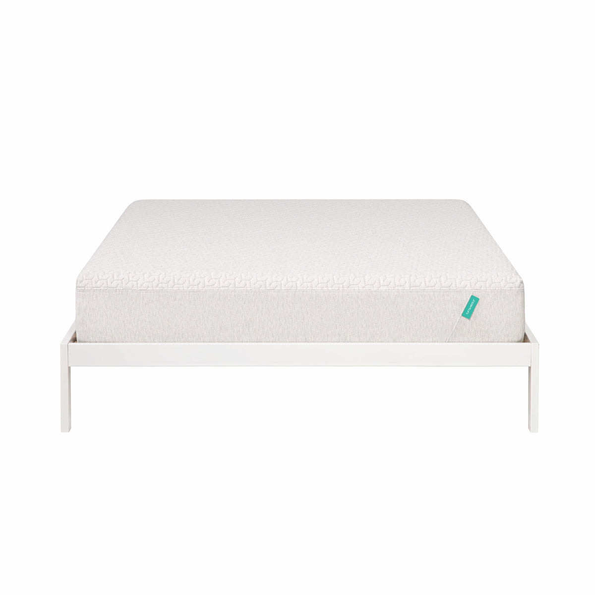 Foam mattress sites on a white bed frame. 