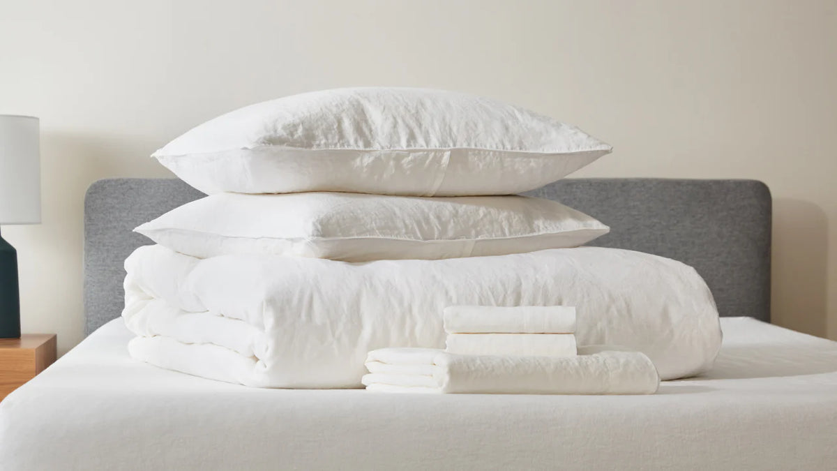 Duvet, sheet, and pillow set on top of bed