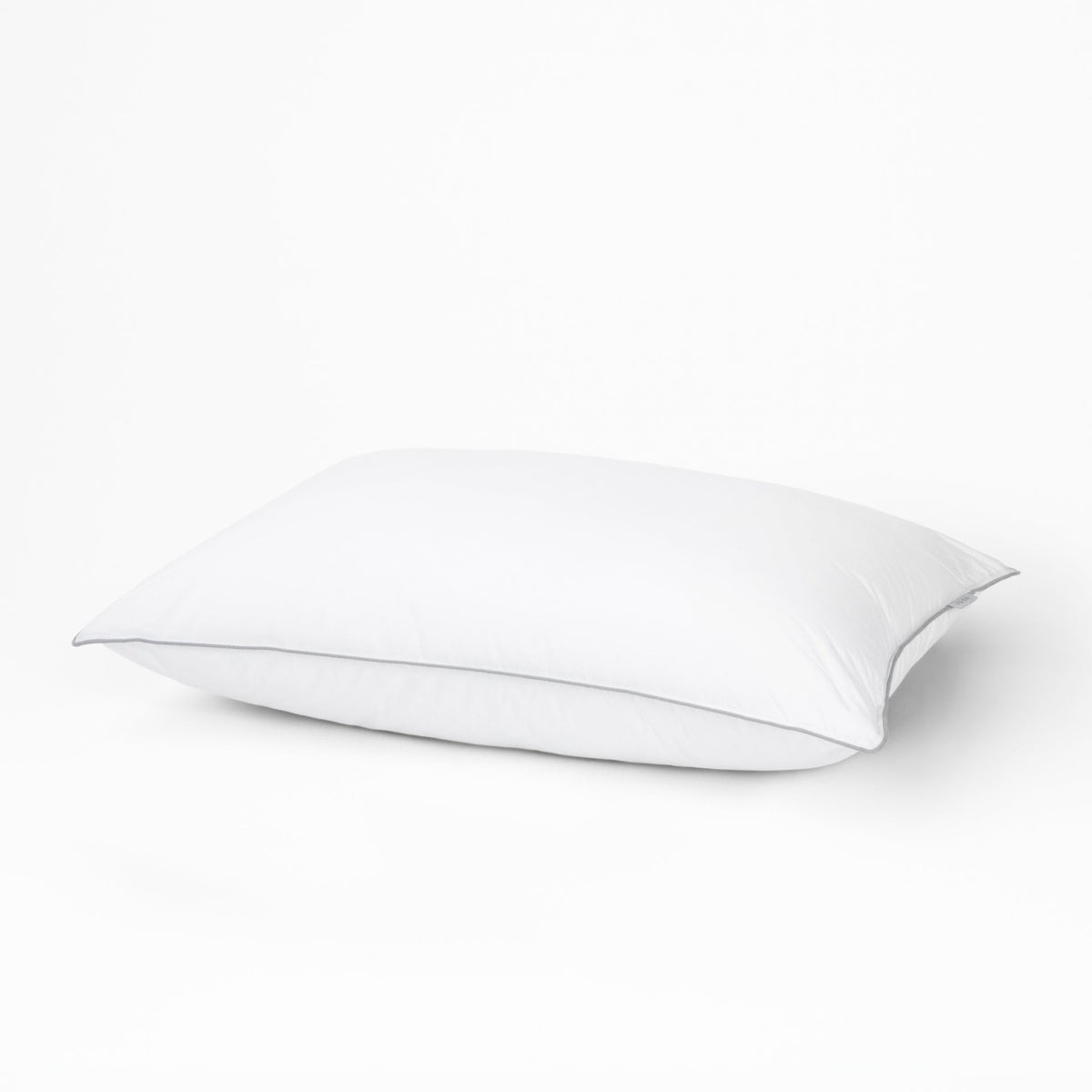A pillow with the Tuft and Needle Down Alternative Pillow case