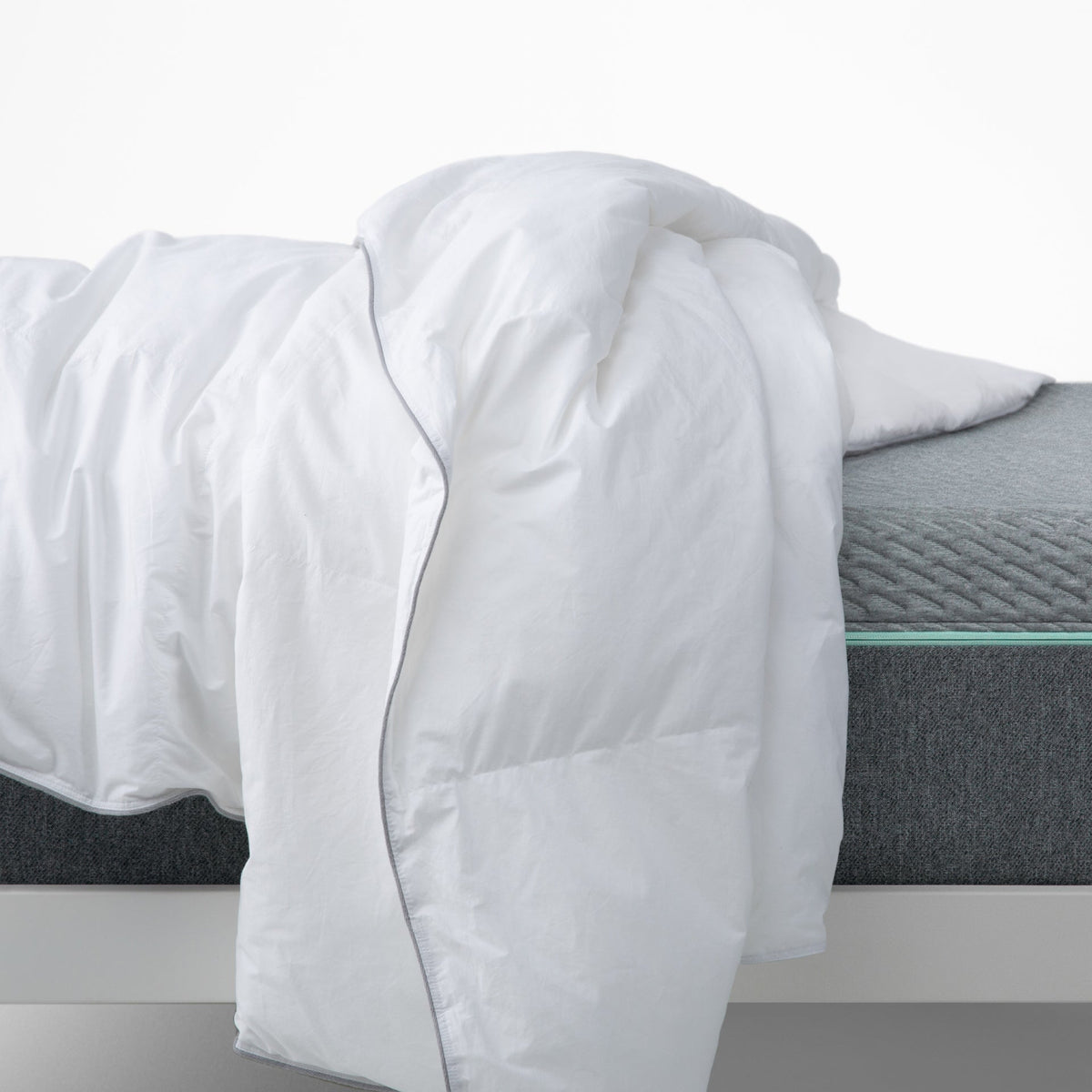 The  Tuft and Needle Down Duvet Insert on a bed||weight:medium