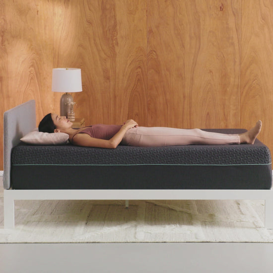 Tuft & Needle Mint Hybrid Mattress short video showing a woman laying on her back the turning onto her left side
