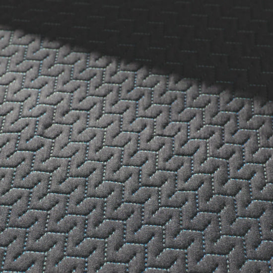 close up of a hand pressing into the top of the 14 inch hybrid mattress